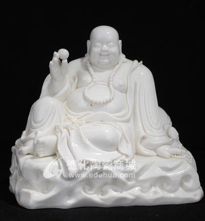 坐巖石戲珠笑佛